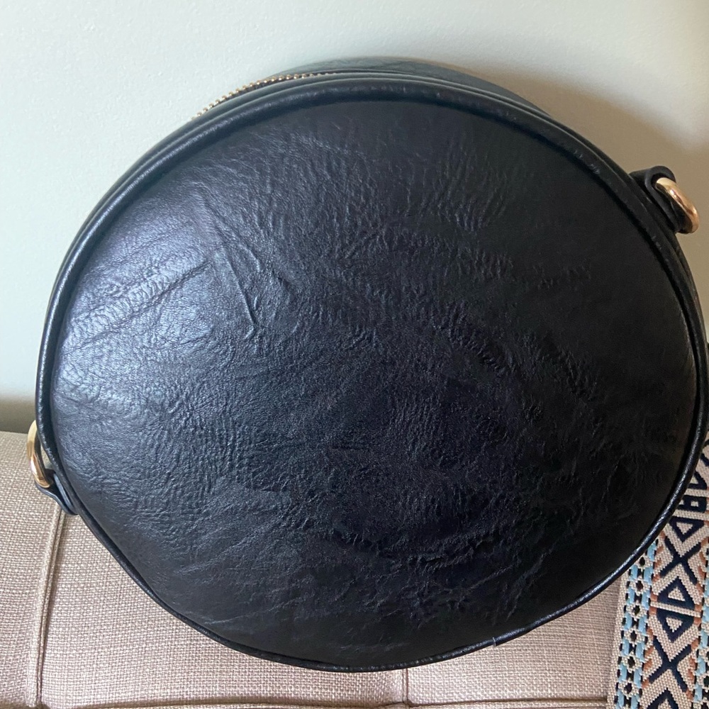 Black leather crossbody with 2 straps.